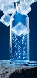 Clear bottle with ice cubes on blue background.