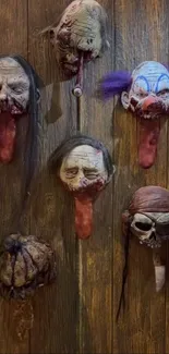 Collection of creepy horror masks on wood wall.