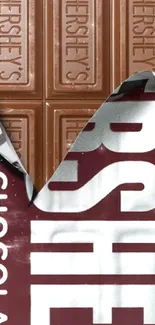 Hershey's chocolate bar with wrapper partially open.