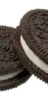 Close-up of chocolate sandwich cookies on a white background.