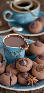 Assorted chocolate cookies and coffee on a rustic wooden table with blue crockery.