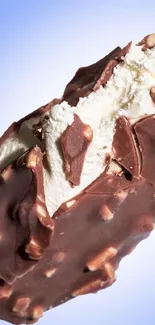 Close-up of chocolate ice cream with a blue backdrop.