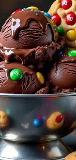 Chocolate ice cream with colorful candy and cookies in a bowl.