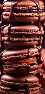 Stack of chocolate macarons with rich drizzle.