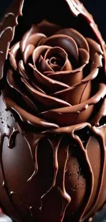Intricate chocolate egg with rose design.