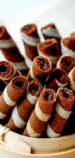 A close-up of chocolate wafer rolls in a container.