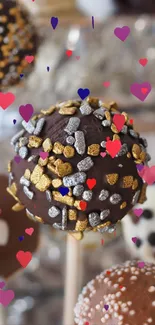 Chocolate cake pops adorned with sprinkles.