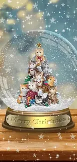 Festive Christmas cats in snow globe with a star on top.