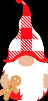 Christmas gnome with gingerbread on a black background.