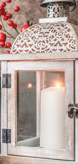 Christmas lantern with candle, pinecones, and red berries.