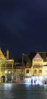 Festive city square with Christmas tree lights and historic architecture at night.