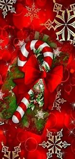 Festive red candy cane wallpaper with golden snowflakes.