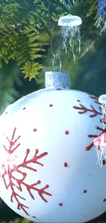 Christmas ornament with jellyfish on a green background.