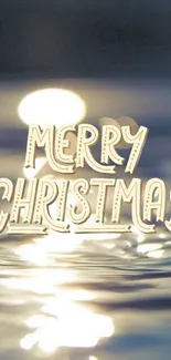 Merry Christmas text on calm water reflection background.