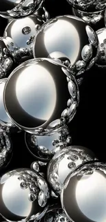 Chrome spheres on black background wallpaper.