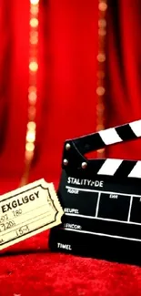 Cinematic wallpaper with red backdrop and clapperboard.