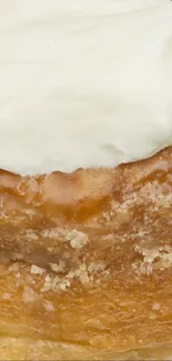 Close-up of a cinnamon roll with icing.