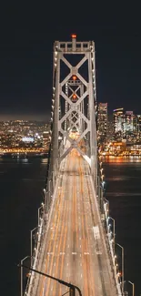Bridge illuminated against a city night skyline, perfect wallpaper for urban lovers.