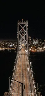 A stunning nighttime view of a city bridge with an illuminated skyline.