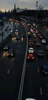 Evening city traffic along urban river road.