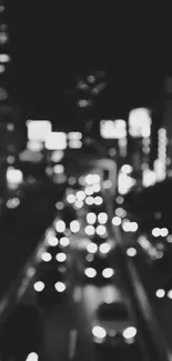 Monochrome bokeh effect of city lights at night.