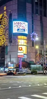 Urban nightscape with neon lights and buildings at dusk.