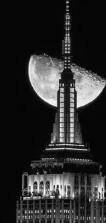 Black and white wallpaper of a city skyline with a prominent moon.