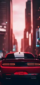 Red car in a vibrant city at night.