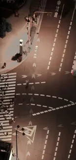 City crosswalk at night with lighted paths.