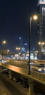 City highway at night with skyscrapers and streetlights illuminating the scene.