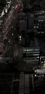 Aerial view of bustling city street at night.