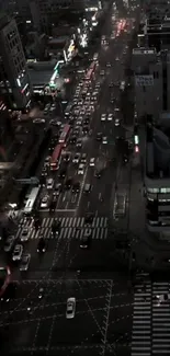 Aerial view of a city street bustling with night traffic.