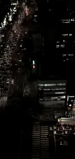 Nighttime city scene with busy traffic and illuminated streets.