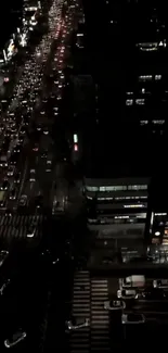 Aerial view of city night traffic with illuminated streets.