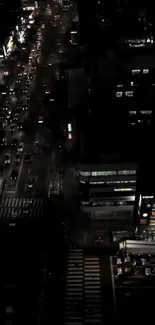 Nighttime urban street view with glowing traffic lights.