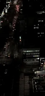 A vibrant city street view at night with illuminated urban lights.