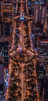 Aerial view of vibrant city nightscape with bright urban lights.