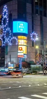 Vibrant city nightscape with glowing neon lights and festive decorations.