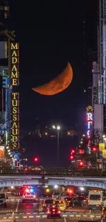 A stunning cityscape with a red moon at night.