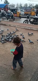 Child feeding pigeons in bustling city street.