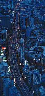 Aerial view of a city skyline at night with vibrant lights.