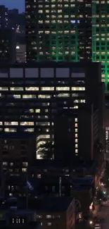 City skyline at night with illuminated skyscrapers and city lights, showcasing urban beauty.