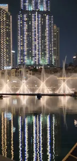 Night city skyline with reflections on water.