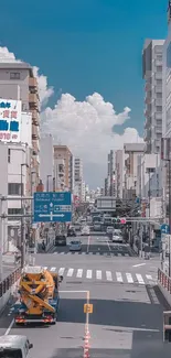 Vibrant city street view with skyscrapers and blue sky.