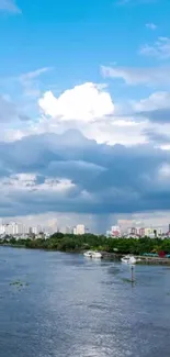 City skyline with river and blue sky wallpaper.