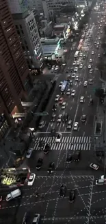 A bustling city street at dusk with cars and buildings illuminated by streetlights.