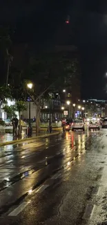 Nighttime city street with wet surface and glowing streetlights.