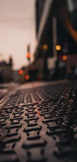 Urban street perspective wallpaper with textured ground and city lights.