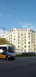 Classic building with urban traffic under a blue sky scene.