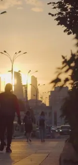 City street at sunset with people walking, warm orange sky.